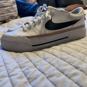 Nike women’s  White Sneakers with Black Swoosh